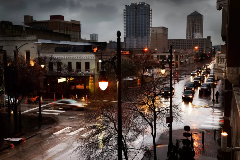 View of rainy Sixth Street with grey sky in Austin, Texas